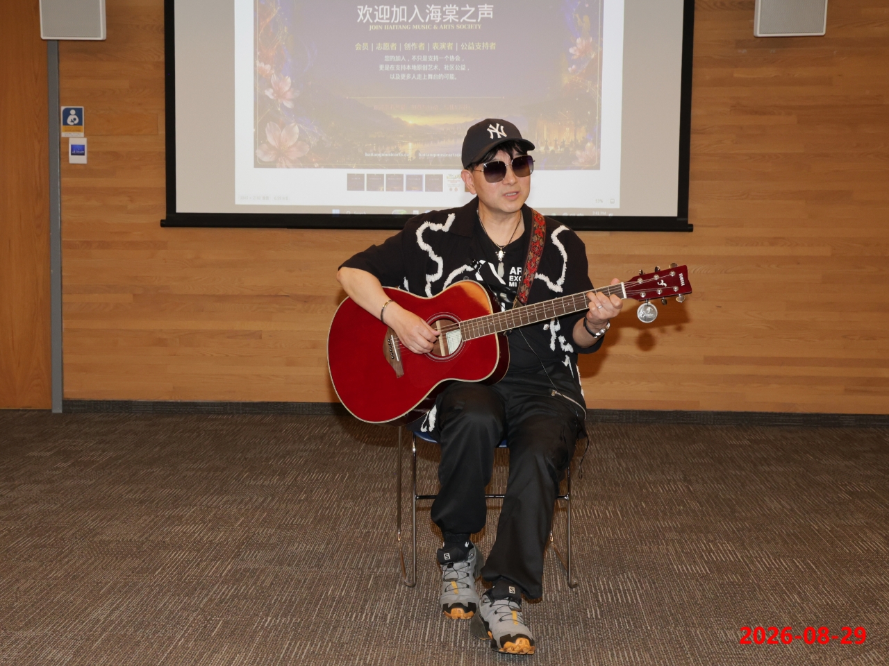 William Zhang performing with acoustic guitar